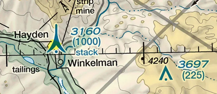 Obstacle symbol on a sectional chart: triangle with dot, lightning bolt, top elevation in MSL and structure height in AGL parentheses